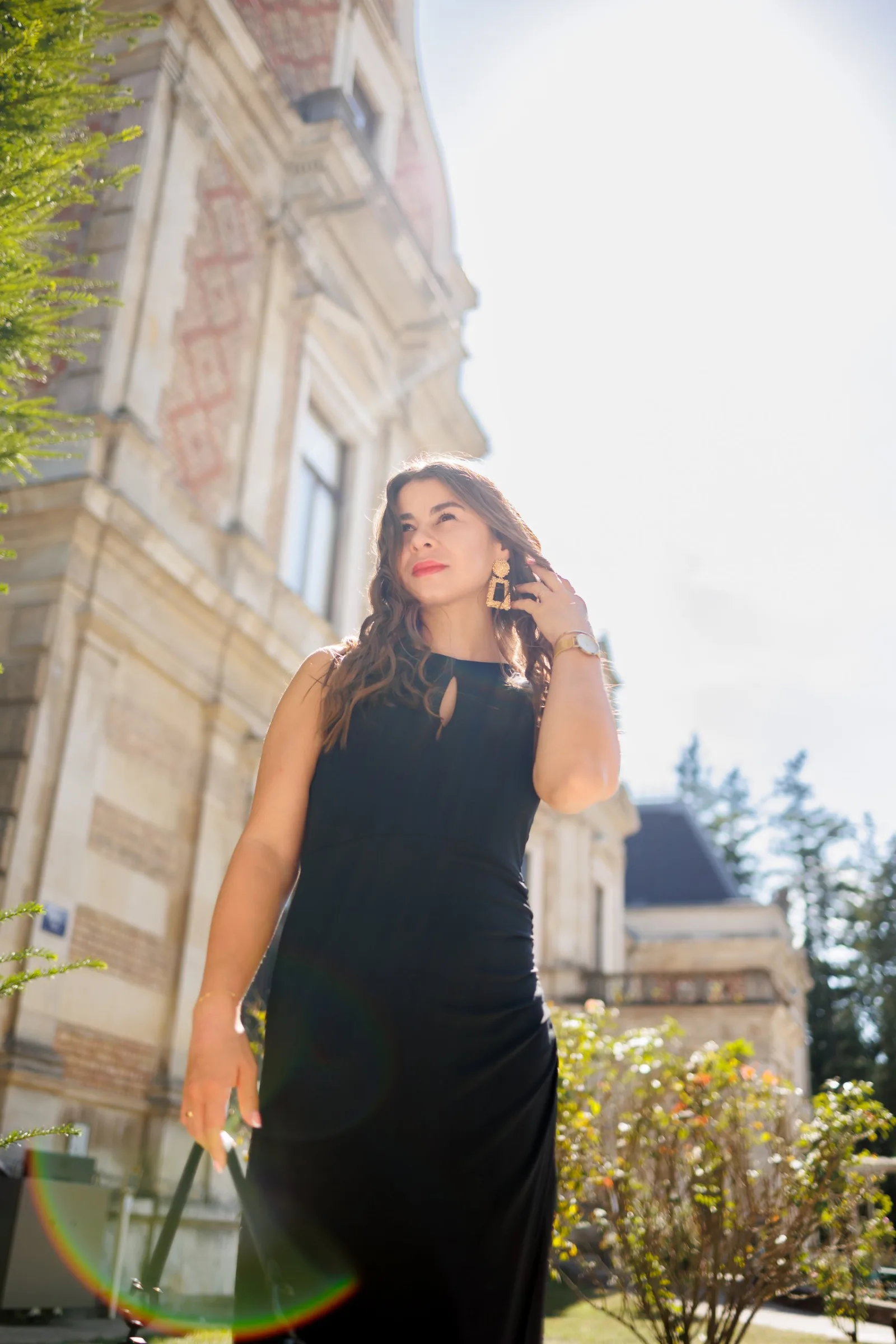 Backlit portrait of a woman near a Viennese palace